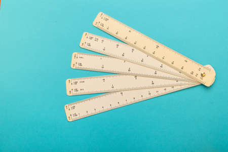 White flat scale ruler on blue backgroundの写真素材