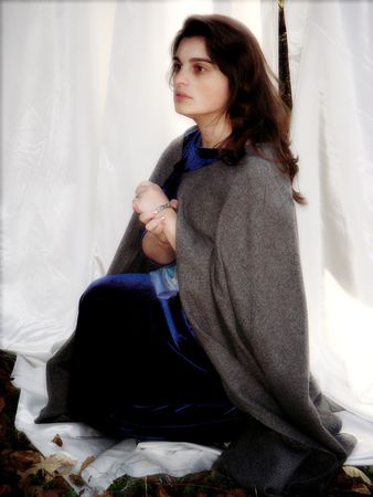 Young woman in a cape - soft glow mapの写真素材