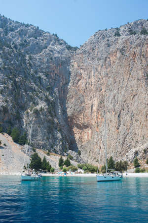 Beautiful bay and beach seen from a yatch. Blue sky and turquoise waterの写真素材