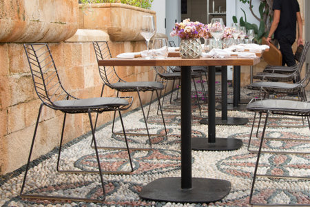 Tables nicely arranged in a fancy restaurant at Lindos, Rhodes, Dodecanese, Greeceの写真素材