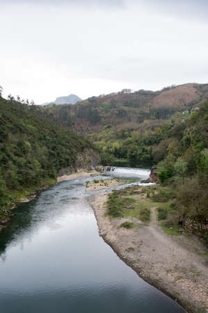 Beautiful landscape with Nalon river and mountains around near Las Caldas, Oviedoの写真素材