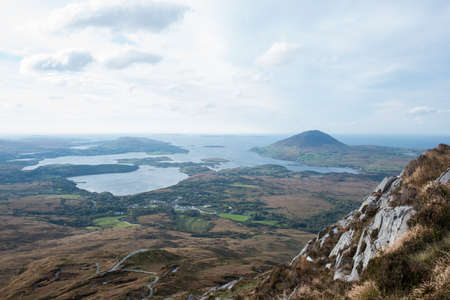 Mountain landscape seen from the top of the hill. Sky with clouds. Ireland, Eiuropeの写真素材