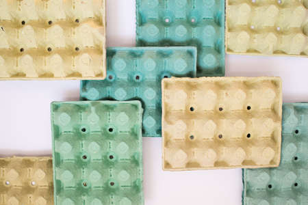 Colorful design with cardboard trays for eggs. Recycling. White background