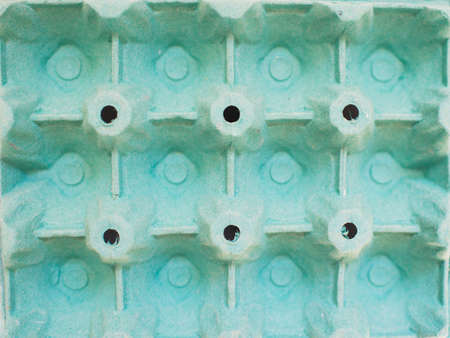 Green cardboard tray for eggs with geometric pattern. Beautiful designの写真素材