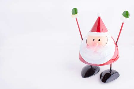 Santa Claus toy with hands up made of metalの写真素材