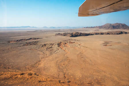 Beautiful scenery from an airplane in Namib desert. Many fairy circles, sunny day, no people.Namibia, Africaの写真素材