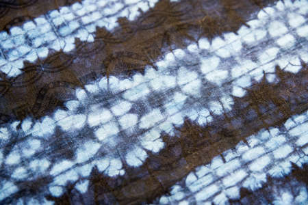 Background in blue and black. Flower pattern with dye effect.の写真素材