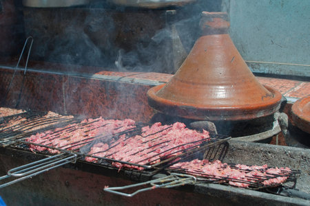 Tajine and grilled meat.Preparing morocan food by the traditional way. Moroccoの写真素材