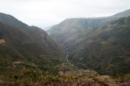 Beautiful aerial view of a green valley with river. Saraguro, Ecuador. No peopleの写真素材