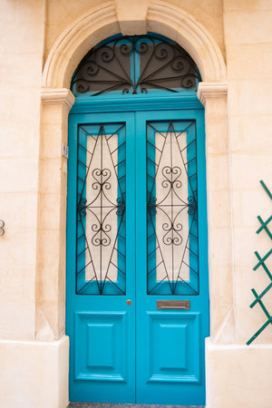 Beautiful traditional entrance door. Blue color with a grid. Malta, Europeの写真素材