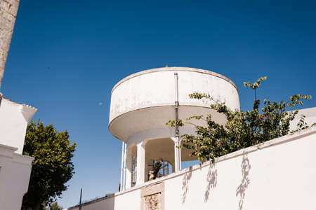 old water tank converted into a large dark chamber in which you can see the city of Tavira, in the Algarve of Portugalのeditorial素材