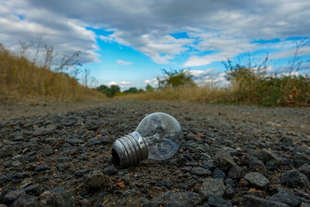 light bulb on a gravel roadの写真素材