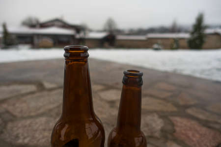 two bottles of beer outsideの写真素材