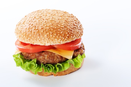 Cheeseburger with tomatoes and lettuce isolated on whiteの写真素材