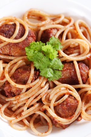 Pasta with meatballs and tomato sauce on white background の写真素材