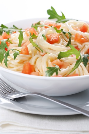 Pasta with tomato and rucola in bowlの写真素材