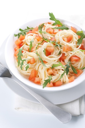 Pasta with tomato and rucola in bowlの写真素材