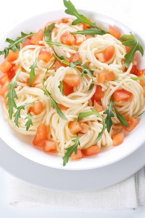 Pasta with tomato and rucola in bowlの写真素材