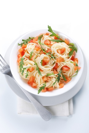 Pasta with tomato and rucola in bowlの写真素材