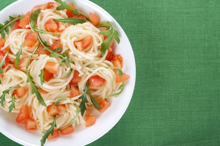 Pasta with tomato and rucola in bowlの写真素材