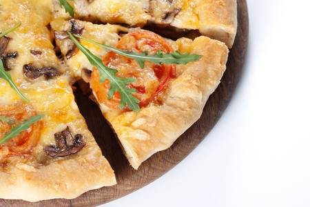 Fresh baked pizza with mushroom, tomatoes and rucolaの写真素材