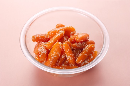 Honey glazed baby carrots with sesame seedsの写真素材
