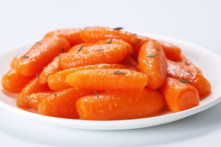 Honey glazed baby carrots with thymeの写真素材