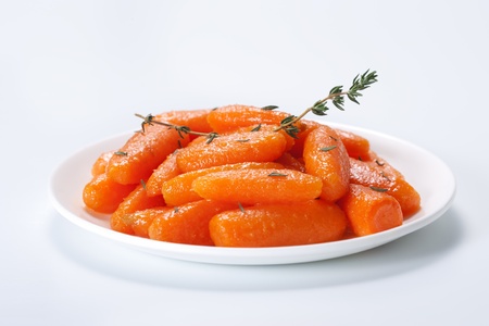 Honey glazed baby carrots with thymeの写真素材