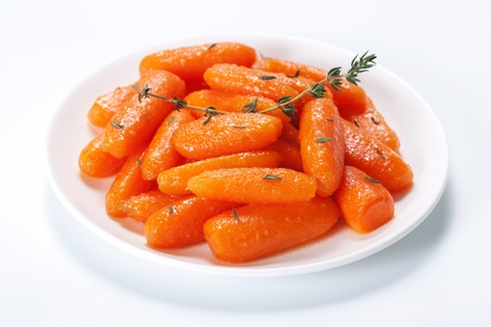 Honey glazed baby carrots with thymeの写真素材