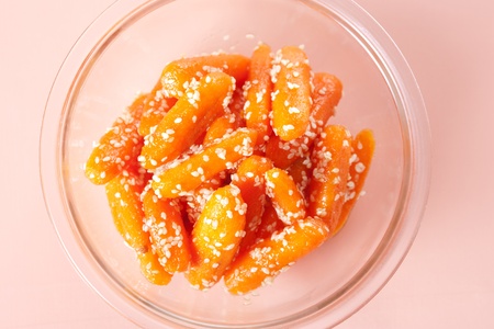 Honey glazed baby carrots with sesame seedsの写真素材