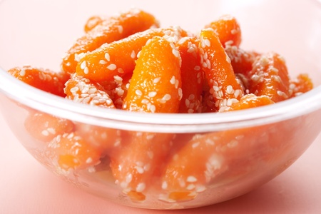 Honey glazed baby carrots with sesame seedsの写真素材