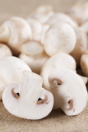Fresh mushrooms champignon on burlapの写真素材