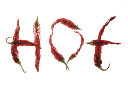 Red hot chilli peppers spelling the word "hot" on white backgroundの写真素材