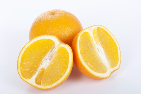 Ripe orange and half on white backgroundの写真素材