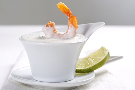 Shrimp dipped in sauce and limeの写真素材