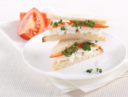 Vegetarian sandwiches with cottage cheese, tomatoes and mustard sproutsの写真素材