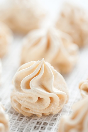 Meringues on white tableclothの写真素材