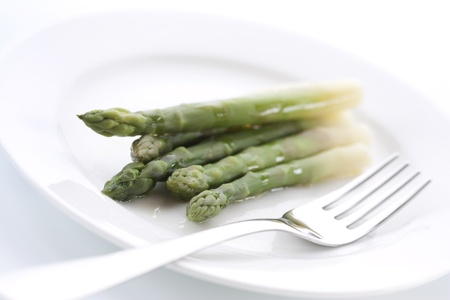 Boiled asparagus on the white plateの写真素材