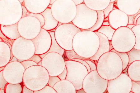 Fresh sliced radish background. の写真素材