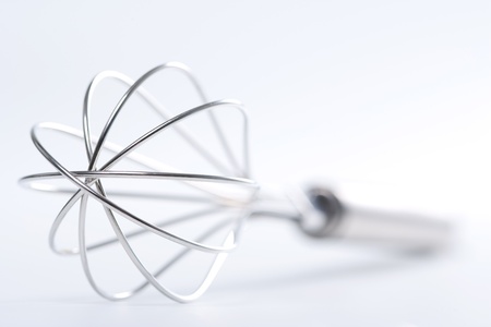 Kitchen whisk isolated on whiteの写真素材