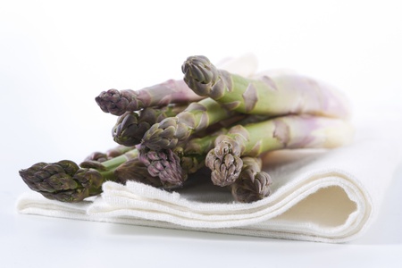 Raw asparagus on a white background の写真素材