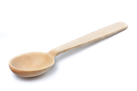 Wooden spoon isolated on white background の写真素材