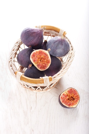 Fresh figs on wood backgroundの写真素材