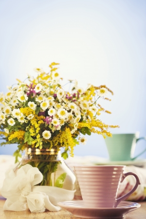 Two cups of tea and summer flowersの写真素材