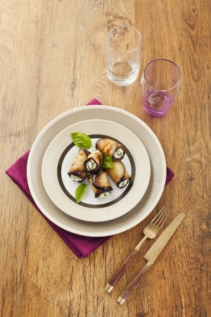 Tasty eggplant rolls stuffed with cottage cheeseの写真素材