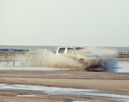 4x4 offroad car driving in mudの写真素材