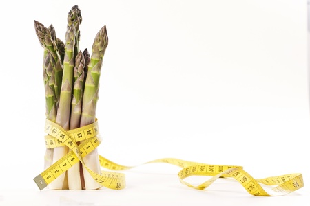 Asparagus and measuring type on a white backgroundの写真素材