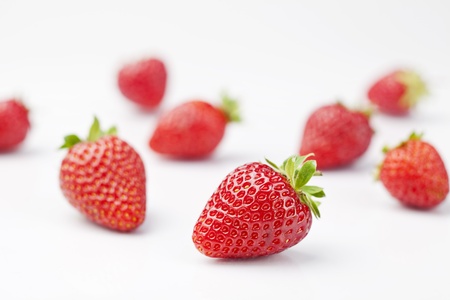 Heap of fresh strawberries on white backgroundの写真素材