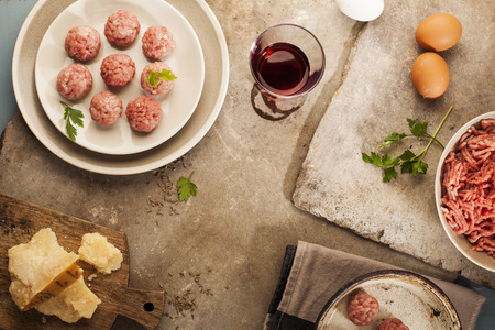 Meatballs cooking with mince, parsley, parmesan, wine and eggs の写真素材
