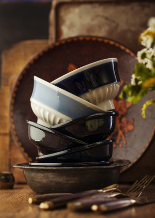 Vintage tableware, cutlery on dark brown wooden backroundの写真素材